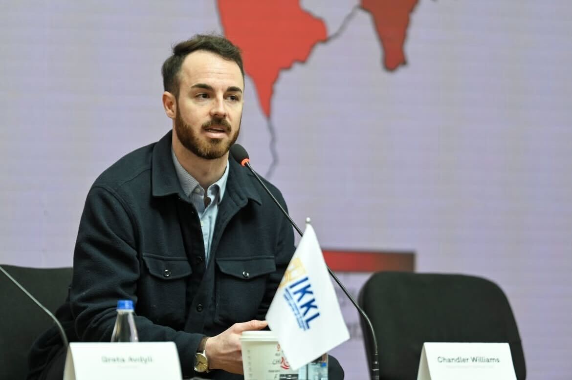 Chandler Williams presenting his research at the Kosovo War's international conference